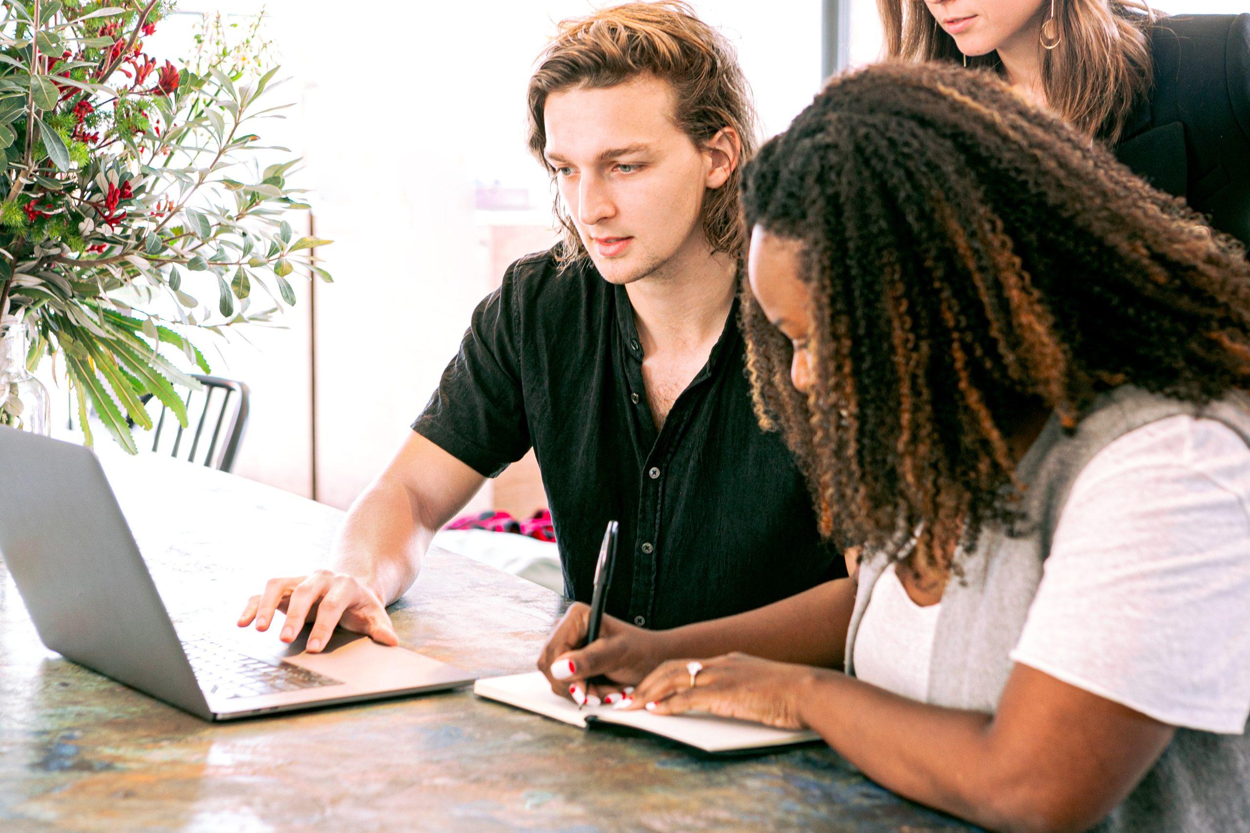 Two entrepreneurs discussing business expansion strategies using credit options